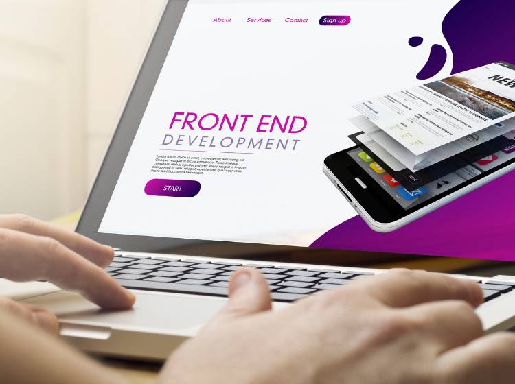 Hands typing on a laptop displaying a webpage about front-end development.
